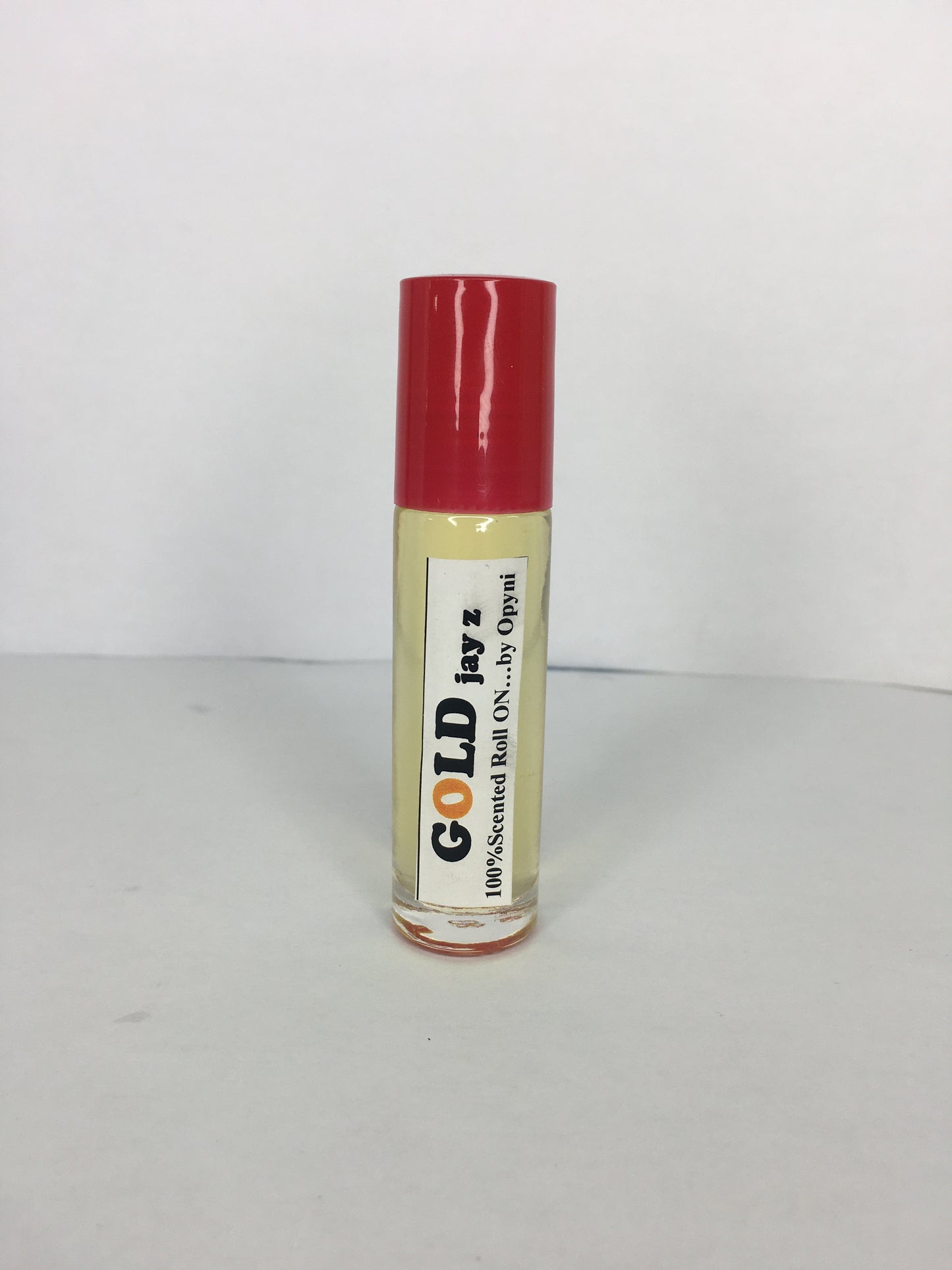 Roll-on labeled Jay Z Gold with brand name Opyneye on a white background