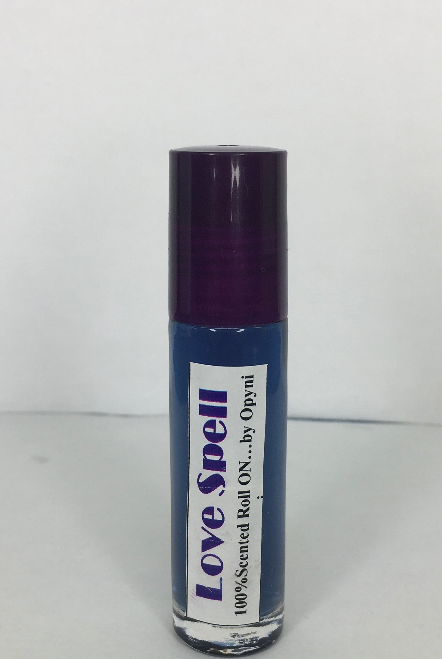Roll-on bottle labeled 'Love Spell' on a white background