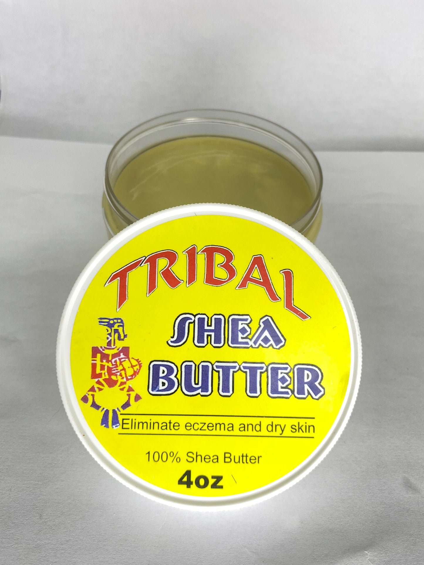 Jar of Tribal Shea Butter on a white background