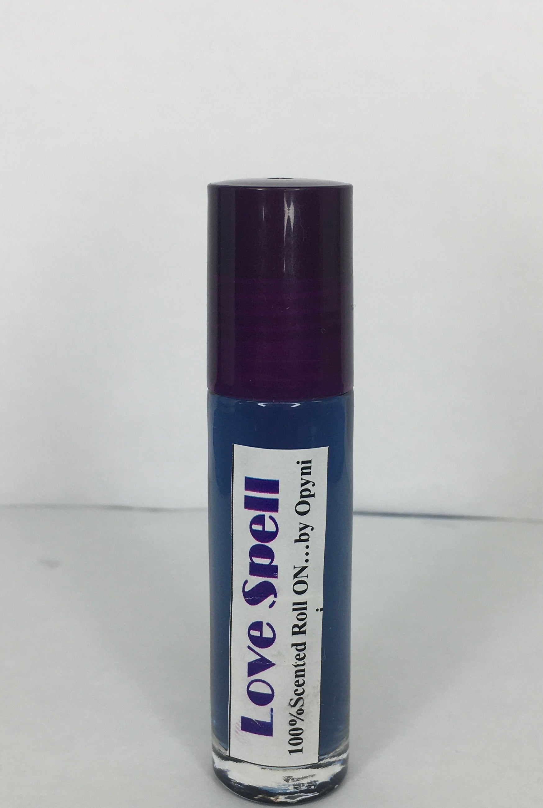 Roll-on bottle labeled 'Love Spell' on a white background
